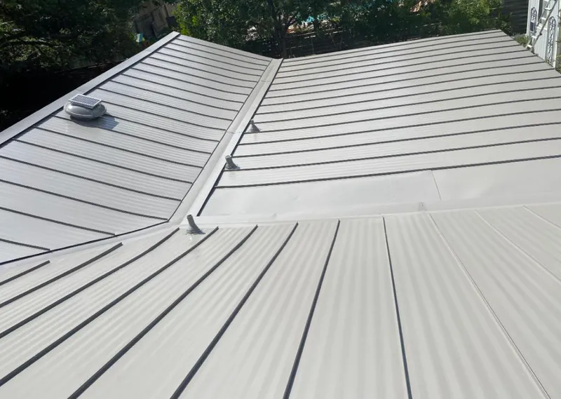 Solar attic fan installed on a metal roof for Roof Ventilation in Oroville East